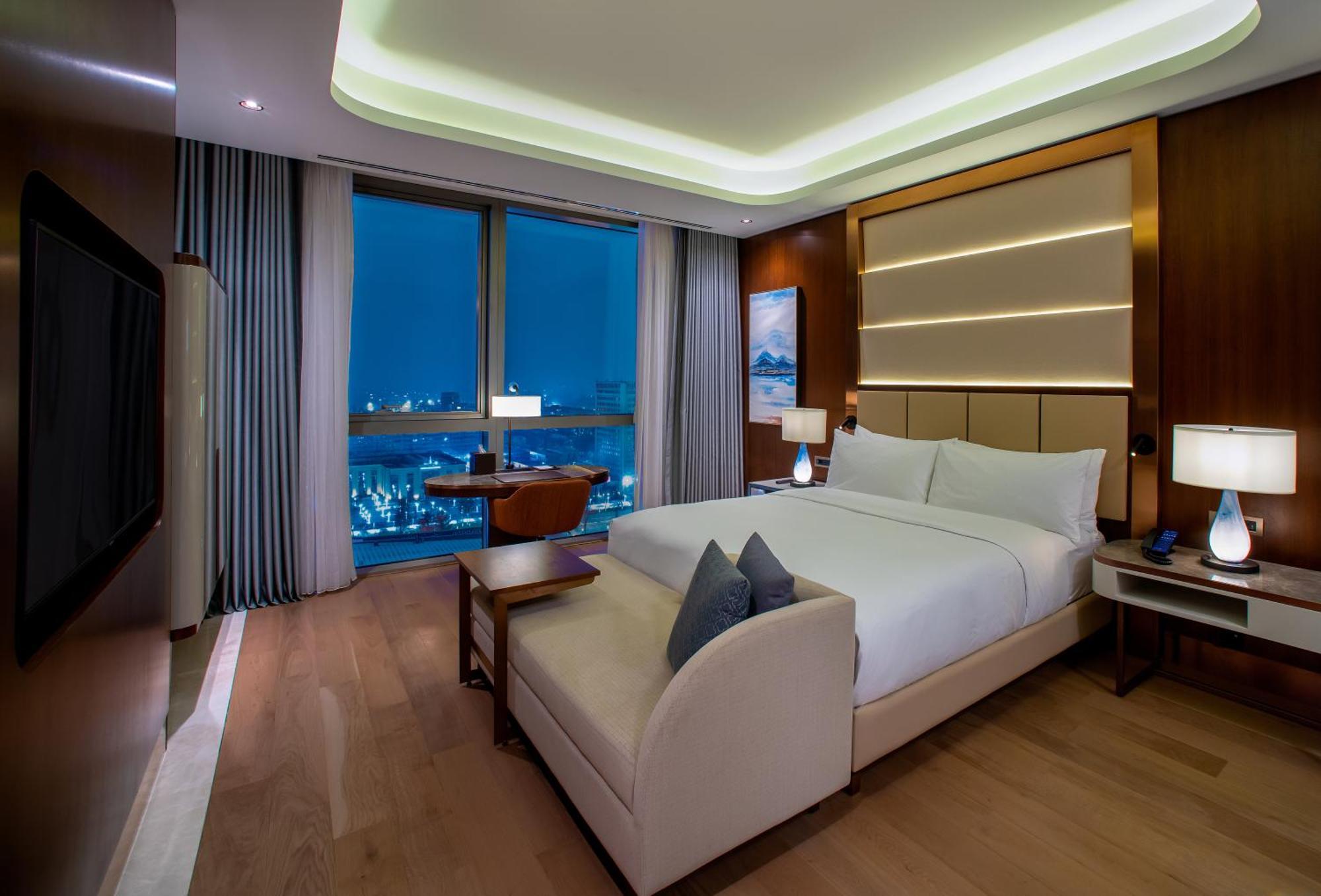 Hilton Tashkent City Екстериор снимка A bedroom at the hotel