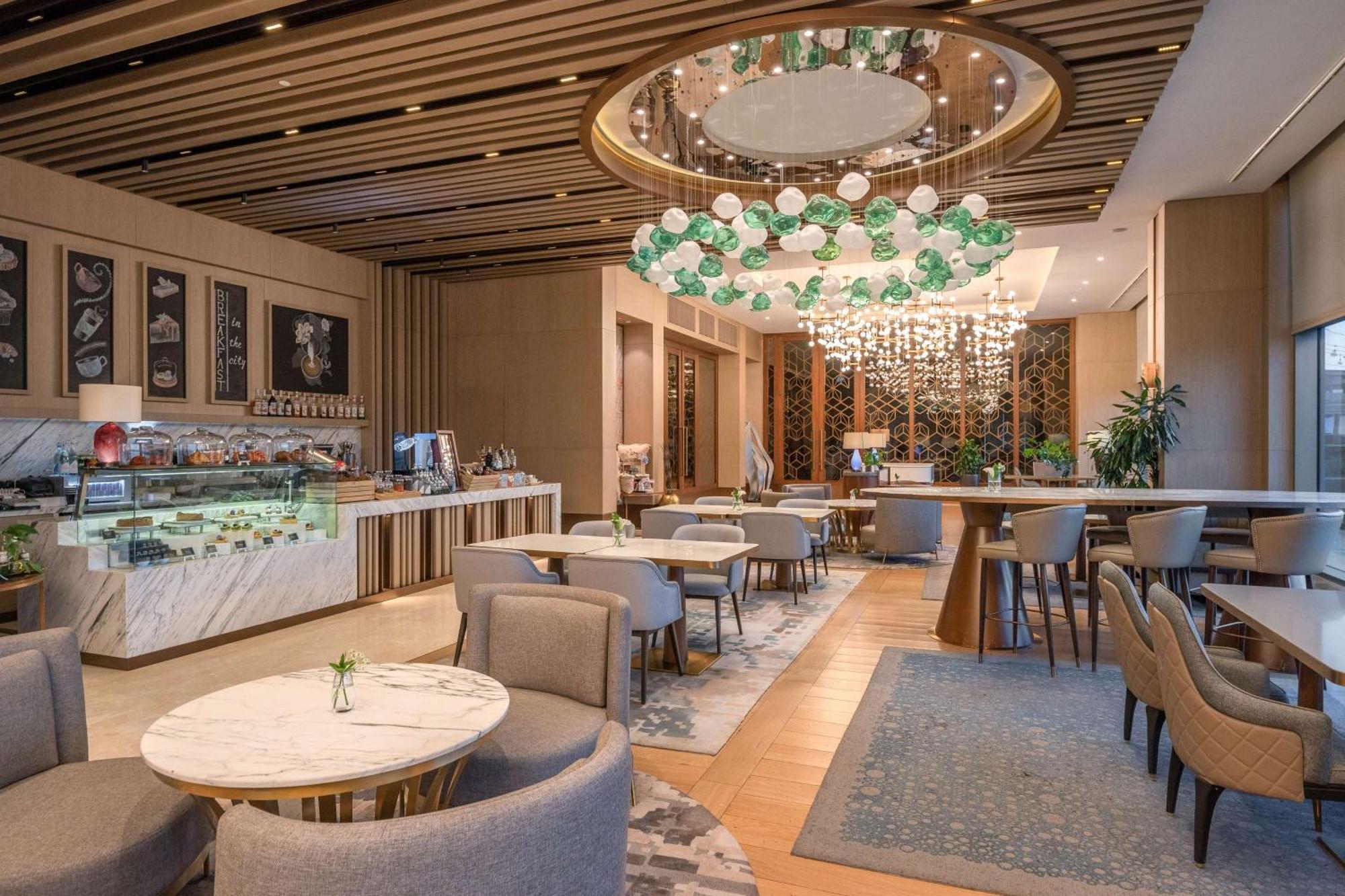 Hilton Tashkent City Екстериор снимка The Lounge at the airport